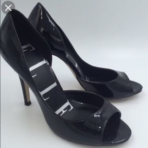 Black patten leather pumps